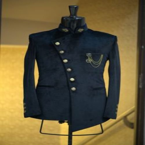 Tailor pinning a fitting on a jacket